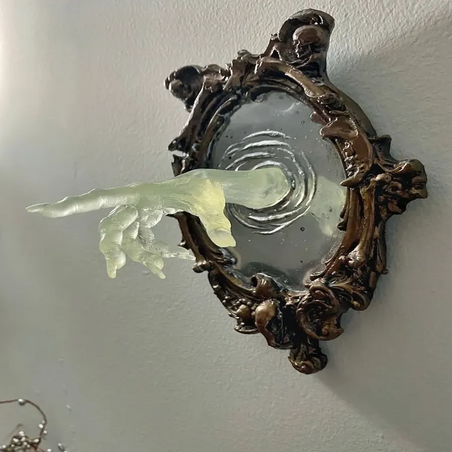 Spooky Wall Sculptures Ofvictorian Ghosts Emergingfrom A Mirror