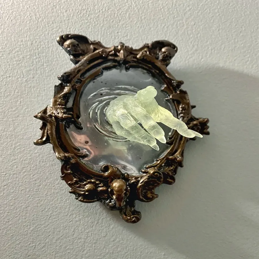 Spooky Wall Sculptures Ofvictorian Ghosts Emergingfrom A Mirror