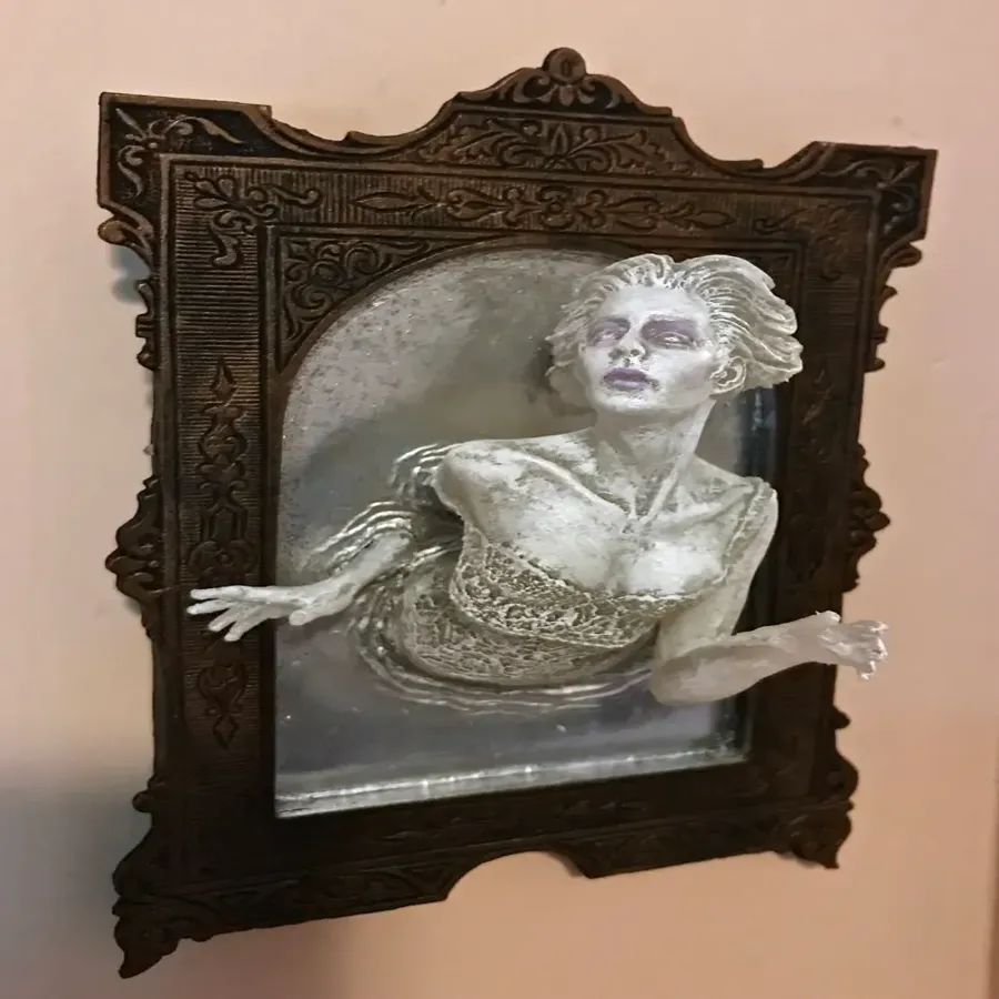 Spooky Wall Sculptures Ofvictorian Ghosts Emergingfrom A Mirror